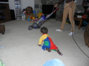 boy approaching vacuum